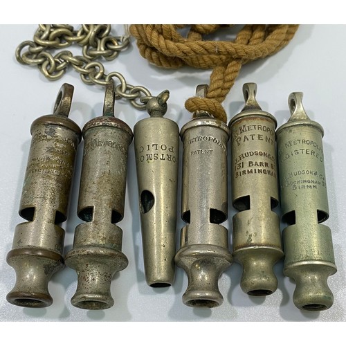 557 - Six various whistles including 'Portsmouth Police' and 5x Metropolitans, one leather pouch (6)