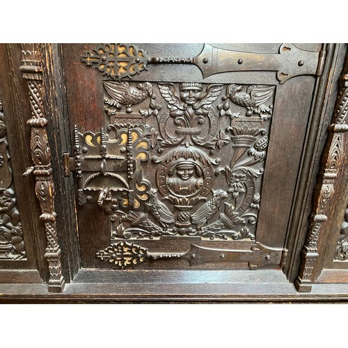 287 - A 19th century continental profusely carved and stained oak cabinet in the renaissance revival style... 