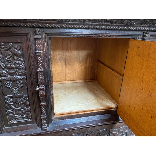 287 - A 19th century continental profusely carved and stained oak cabinet in the renaissance revival style... 