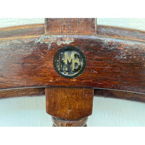 399 - A large stained oak ships wheel with brass ring and hub mounts, reputedly from a Zanzibar sloop, app... 