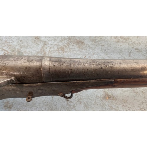 396 - A late 19th/early 20th century Indian/Afghan matchlock Torador musket with inscription to steel barr... 