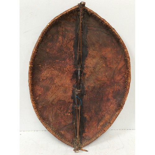 413 - An early 20th century Maasai shield, Kenya hide with painted with red ochre and black geometric deco... 