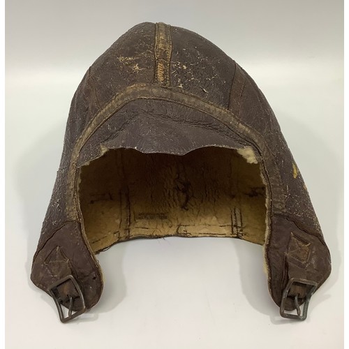 420 - A WWII US Navy pilot's brown leather flying helmet/cap, with sheeps wool lining, (a/f)