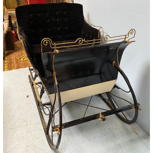 201 - A full size reindeer / horse sled / sleigh with black velvet upholstery and cream, black and gold pa... 