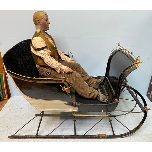 201 - A full size reindeer / horse sled / sleigh with black velvet upholstery and cream, black and gold pa... 