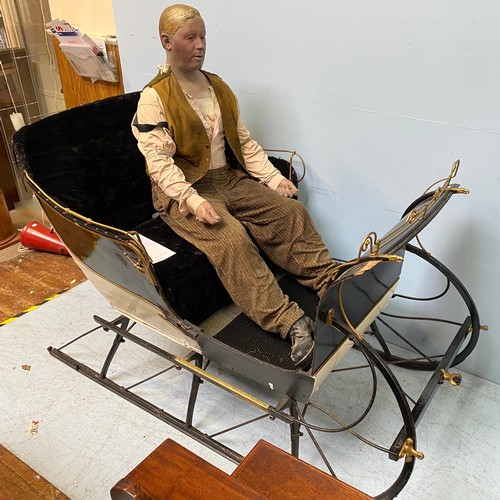 201 - A full size reindeer / horse sled / sleigh with black velvet upholstery and cream, black and gold pa... 