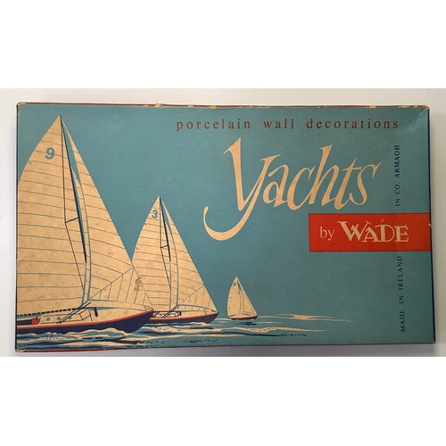 431 - A set of three porcelain yachts by Wade of Ireland, in original box