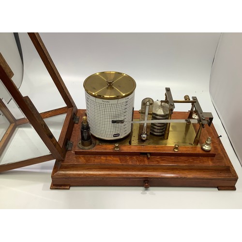 430 - A Russell barograph in oak case with central frieze drawer containing charts, thermometer, bevelled ... 