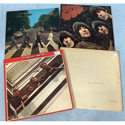 207 - A collection of four vinyl albums by The Beatles including The White Album, numbered ‘0431904’, Rubb... 