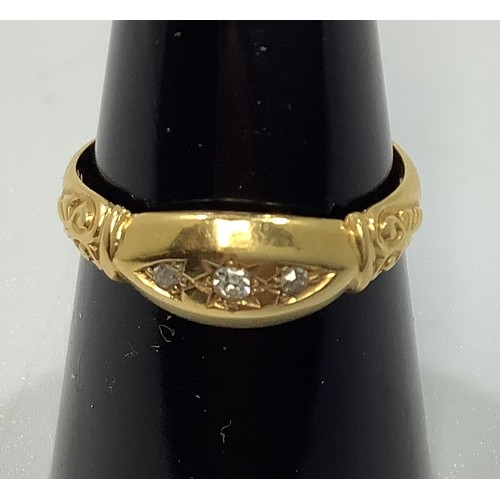 112 - An 18ct gold ring gypsy set with three small diamonds, 2.9g, ring size N