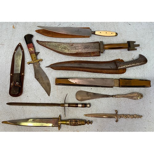 429 - Seven various daggers and sheaths including a Persian style curved dagger, together with a silver ha... 