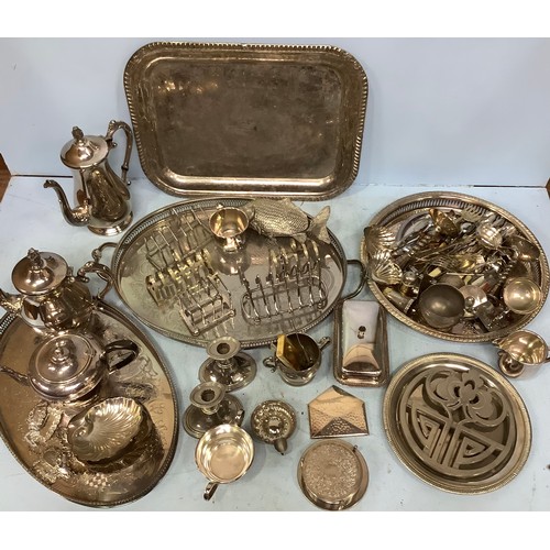 52 - A large quantity of silver-plated items including trays, teapots, toast rack, trivet and flatware et... 