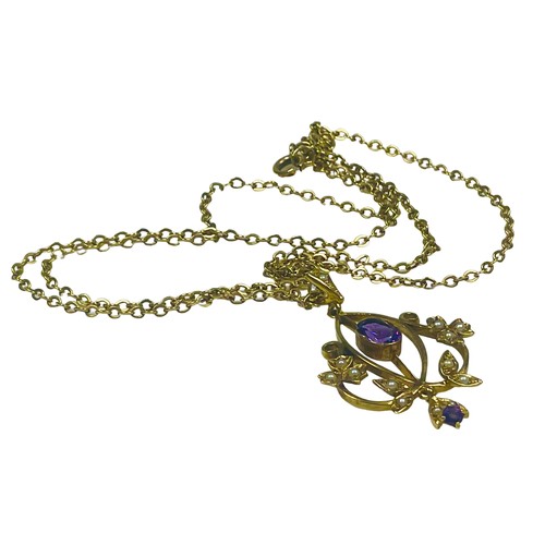 125 - A 9ct yellow gold pendant set with an oval amethyst to the centre, with seed pearls set to the stems... 