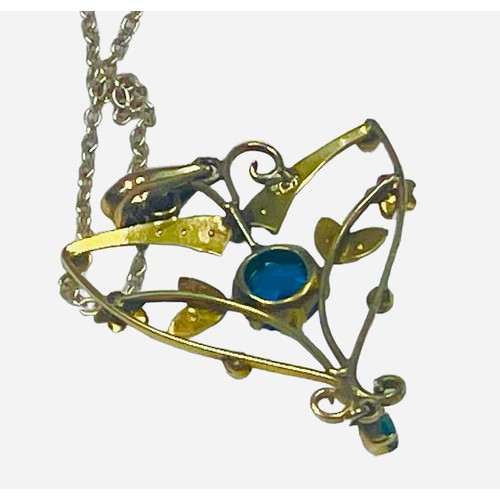 127 - A 9ct yellow gold pendant set with blue faceted stones and seed pearls in a heart shaped design, sus... 