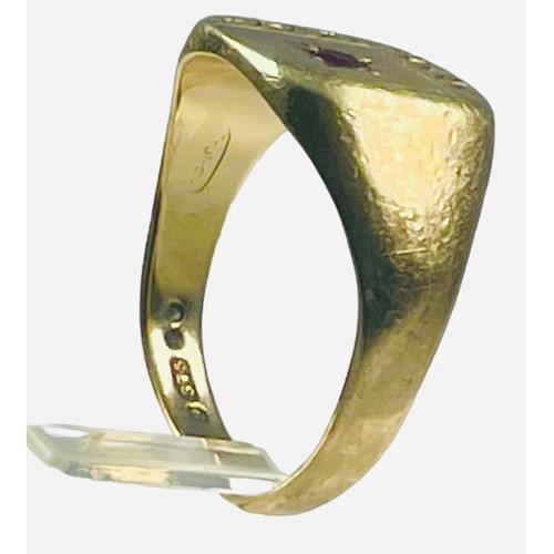 136 - A 9ct yellow gold signet ring, with a star-set garnet to the top, ring weighs 6.3 grams, finger size... 