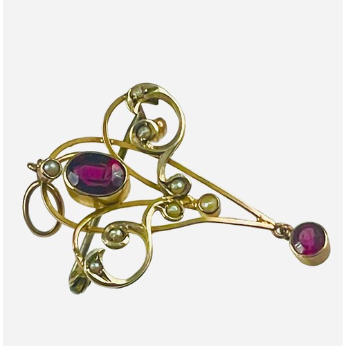 138 - A 9ct yellow gold pendant/brooch, set with an oval red faceted stone to the centre, and a small roun... 