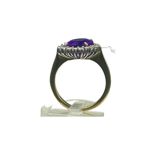 78 - An 18ct yellow gold dress ring, set with a large oval amethyst to the centre, measuring approximatel... 