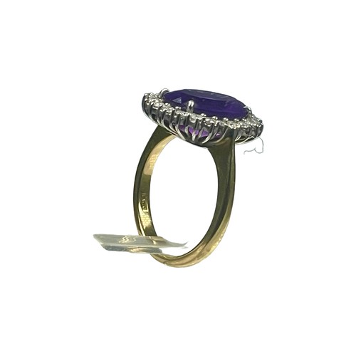 78 - An 18ct yellow gold dress ring, set with a large oval amethyst to the centre, measuring approximatel... 