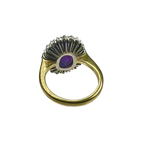 78 - An 18ct yellow gold dress ring, set with a large oval amethyst to the centre, measuring approximatel... 