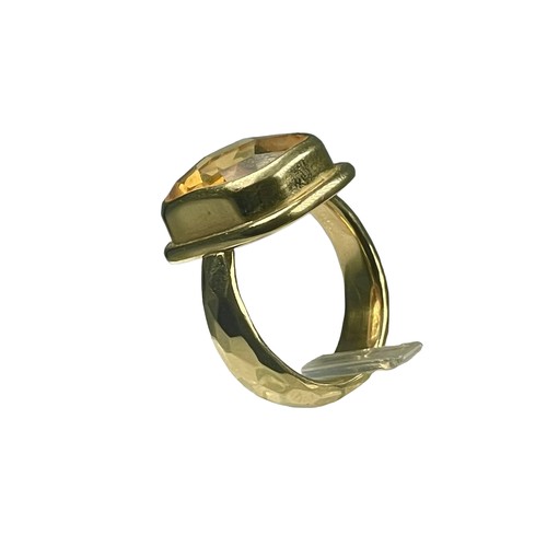 79 - An 18ct yellow gold dress ring set with a faceted cushion shaped citrine coloured stone, measuring 1... 