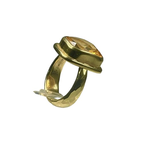 79 - An 18ct yellow gold dress ring set with a faceted cushion shaped citrine coloured stone, measuring 1... 