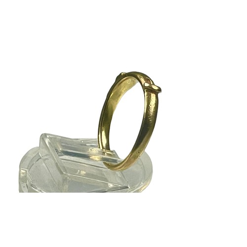 80 - A yellow gold ring, unmarked, possibly 18ct gold, in a buckle design, ring weighs 3.2 grams, finger ... 