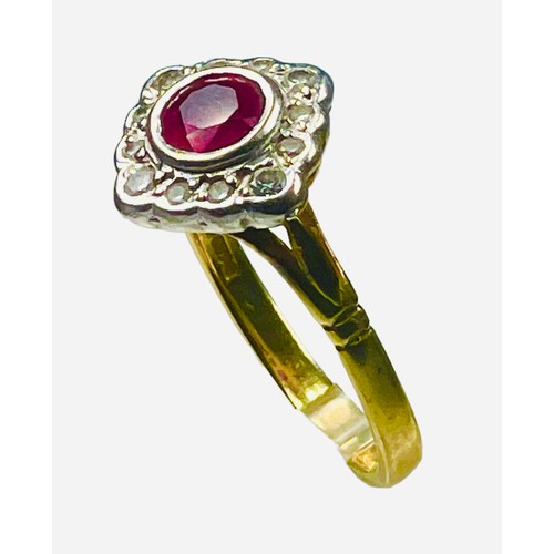 83 - An 18ct yellow gold dress ring, set with a round faceted ruby to the centre, and 12 x small round br... 