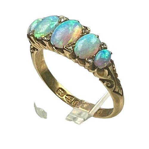 84 - An 18ct yellow gold opal and diamond ring, set with five graduated opals, with small eight-cut diamo... 