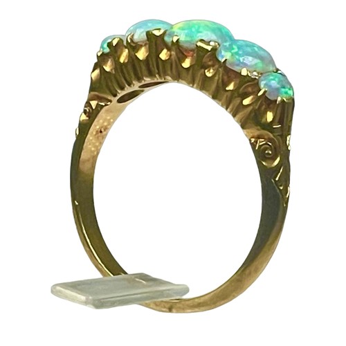 84 - An 18ct yellow gold opal and diamond ring, set with five graduated opals, with small eight-cut diamo... 