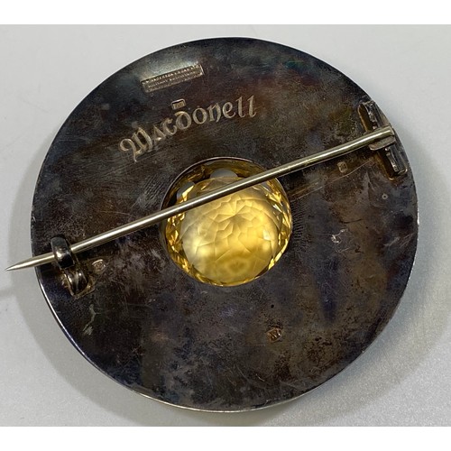 106 - A Scottish silver Plaid Brooch, of circular disc form and claw-set to the centre with a large round ... 