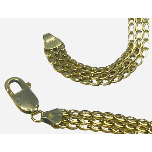 143 - A 9ct yellow gold necklace, in a three row flat link design, weighing 10.8 grams, with lobster catch... 