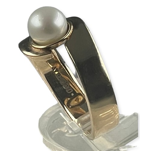 144 - A 9ct yellow gold ring, set with a single cultured pearl, ring weighs 7.0 grams, finger size Q.