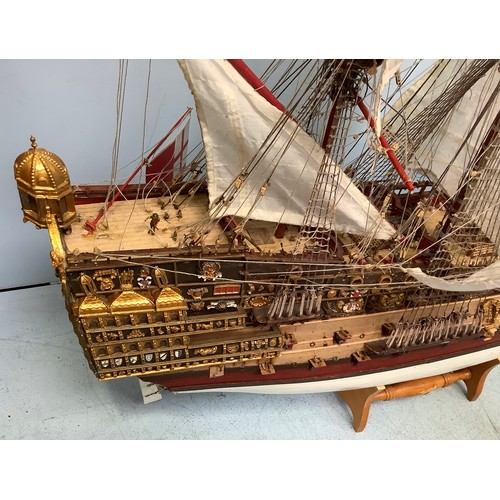 570 - A hand-built model of a fully rigged ship with detailed deck, figures, guns and well painted, 100cm ... 