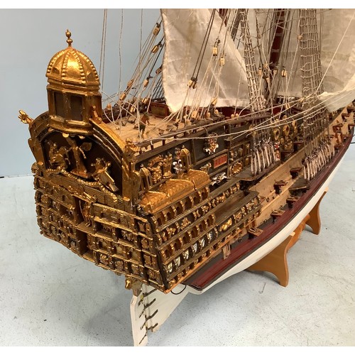 570 - A hand-built model of a fully rigged ship with detailed deck, figures, guns and well painted, 100cm ... 