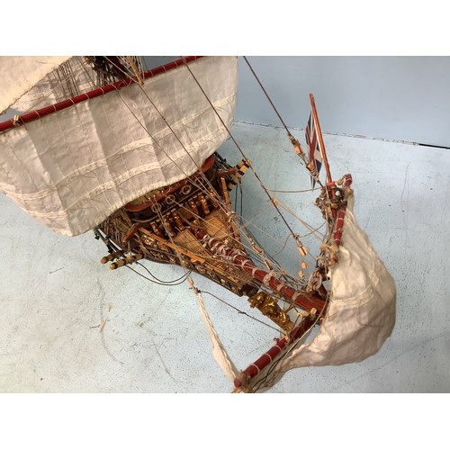 570 - A hand-built model of a fully rigged ship with detailed deck, figures, guns and well painted, 100cm ... 