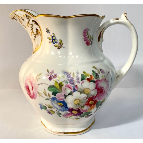 576 - A 19th century porcelain jug, painted with flowers and with a gilt monogram 'VR', 19cm high, reputed... 