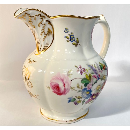 576 - A 19th century porcelain jug, painted with flowers and with a gilt monogram 'VR', 19cm high, reputed... 