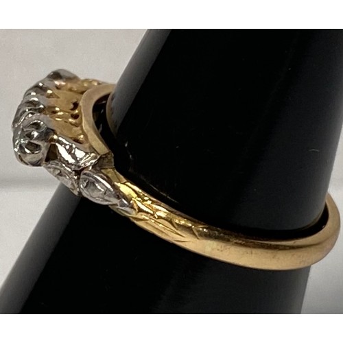 135 - A yellow metal ring, possibly 18ct, set with 4 x Victorian cut diamonds, estimated total weight of d... 