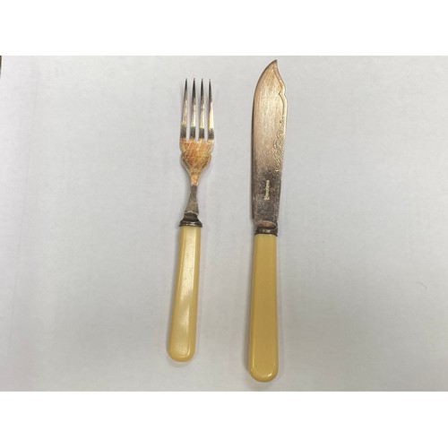 56 - A silver-plated cutlery set housed in an Art Deco two tier oak canteen