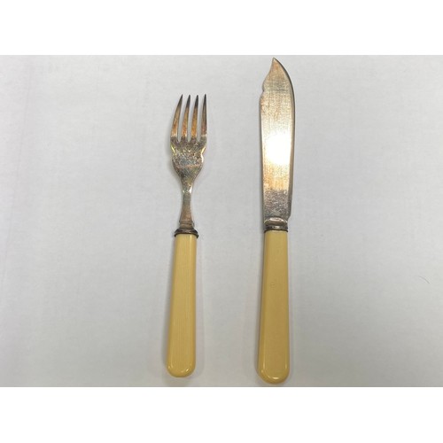 56 - A silver-plated cutlery set housed in an Art Deco two tier oak canteen