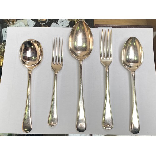 56 - A silver-plated cutlery set housed in an Art Deco two tier oak canteen