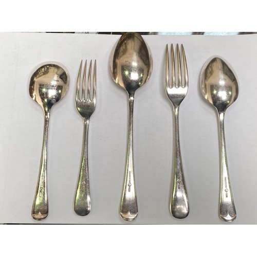 56 - A silver-plated cutlery set housed in an Art Deco two tier oak canteen