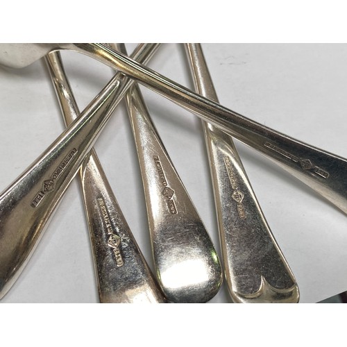 56 - A silver-plated cutlery set housed in an Art Deco two tier oak canteen