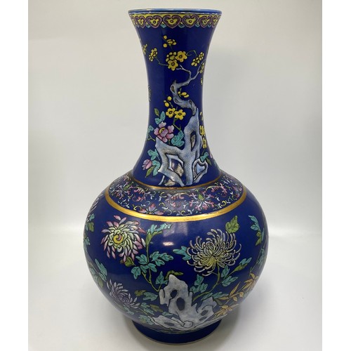 42 - A Chinese Guangxu porcelain vase, of globular form with tall, flared neck, powder blue ground, decor... 