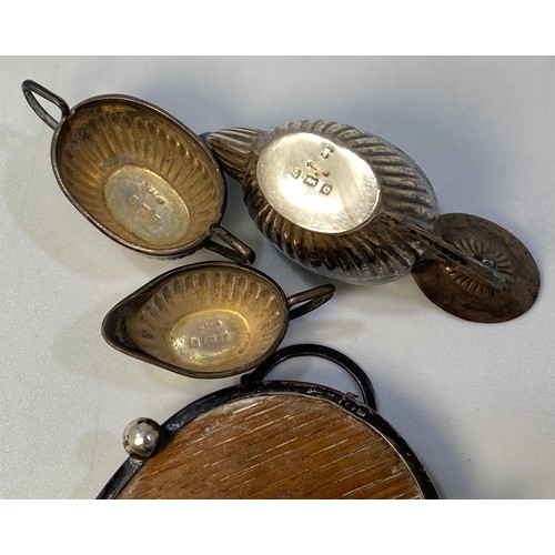 176 - An Edwardian Four-Piece Miniature teaset, comprising teapot, sugar and cream jug on oval pierced gal... 