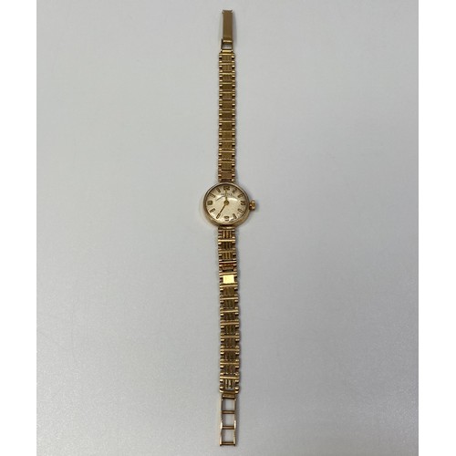 252 - A 9ct gold ladies Vertex Revue wristwatch, the silvered dial with batons denoting hours and Arabic n... 