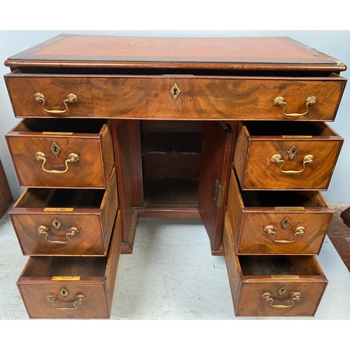 637 - An 18th century and later mahogany kneehole desk of small proportions, tan leather gilt tooled scrib... 