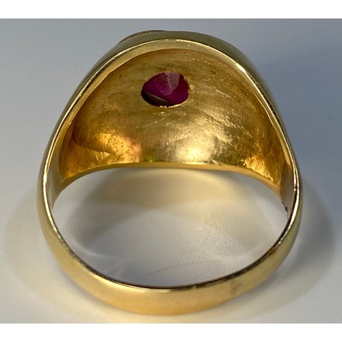 357 - A gents yellow metal ring (tests as 14 or 15ct), set with a sideways heart shaped ruby coloured ston... 