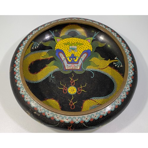 51 - A Chinese Cloisonné bowl of shallow compressed circular form, decorated with a five-claw dragon and ... 