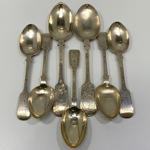 184 - Four Edwardian silver fiddle-pattern dessert spoons with bright-cut decoration, London, 1903-04, tog... 